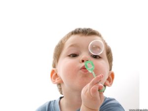 child-playing-with-bubbles